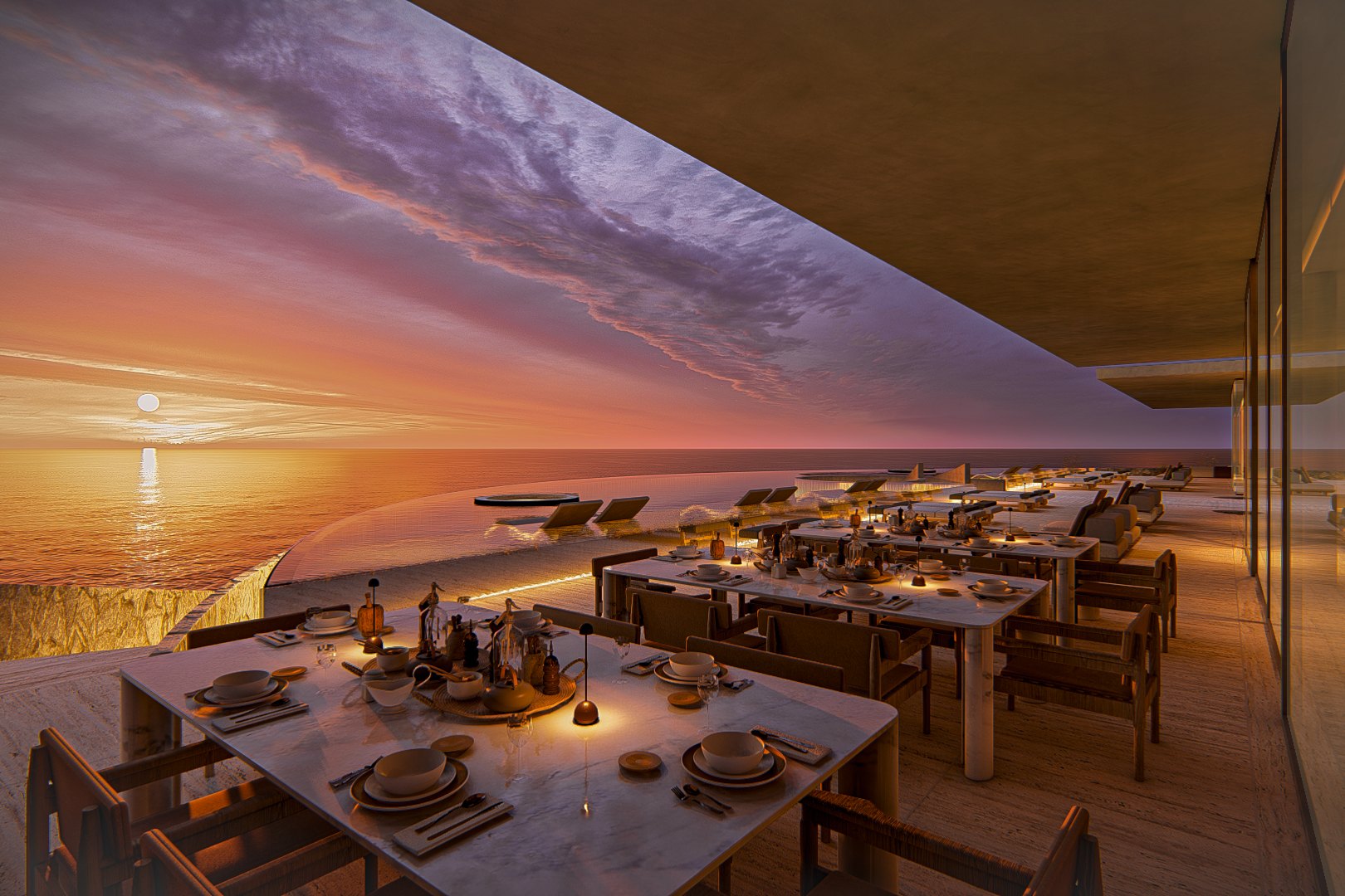 El comedor abierto al horizonte, con el sol en el mar