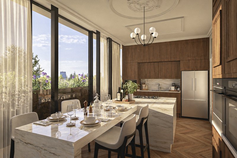 Cocina y comedor con la isla de mármol, abiertos al ventanal